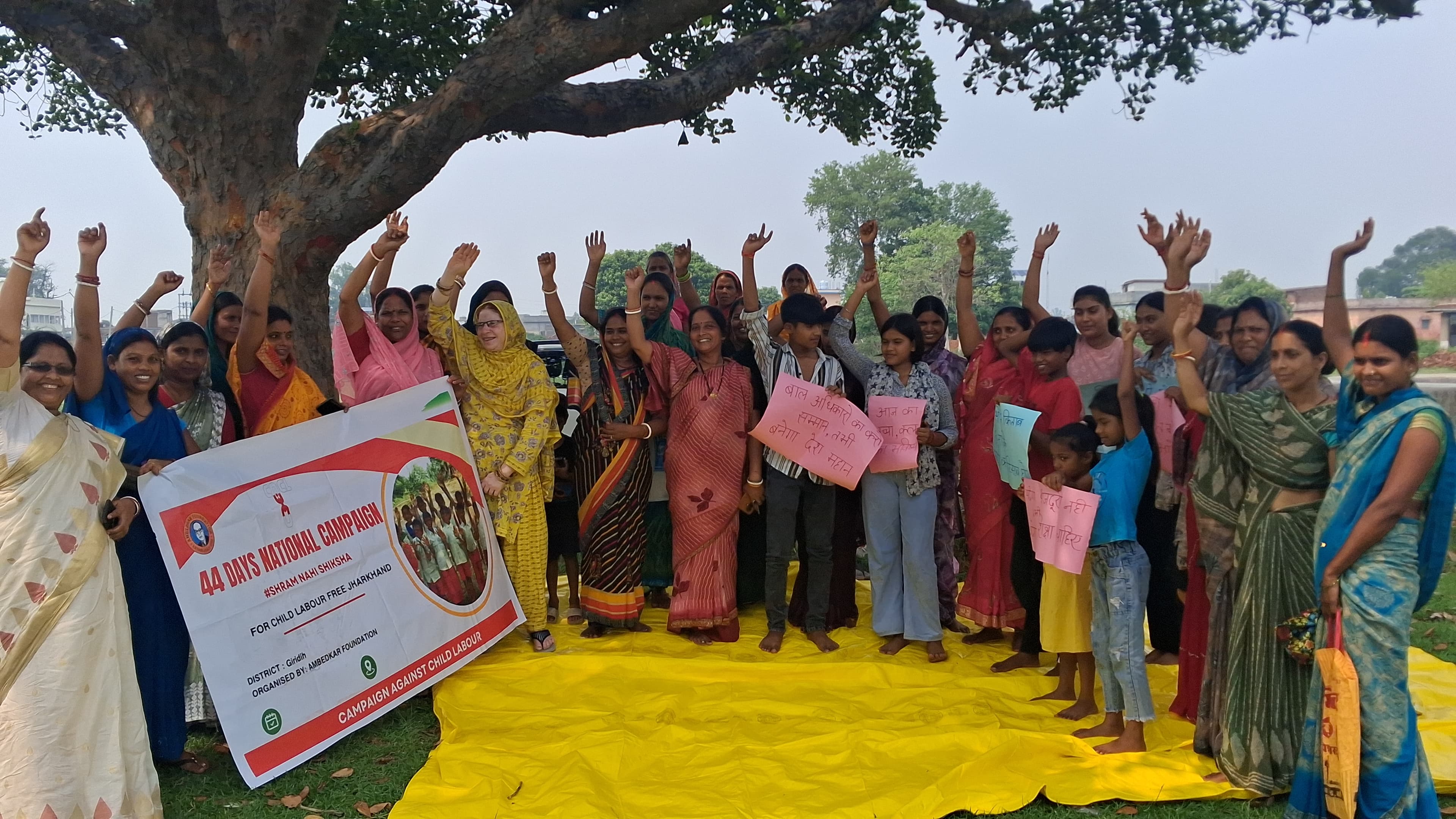 Women and children participating in a community development program